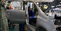 A worker assembles a car at a Nissan's manufacturing plant in Rosslyn file. REUTERS