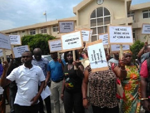 Hannah Bissiw in black leading the demonstration