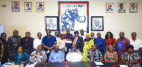 Members of the committee in a photo with executives of the NPP