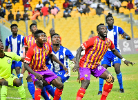 Former Hearts of Oak players, Victor Aidoo and Emmanuel Nettey in action against Olympics