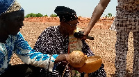 Traditional authorities pouring libation ahead of the project