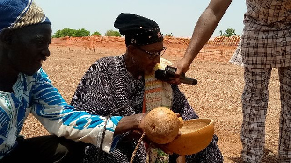 Traditional authorities pouring libation ahead of the project