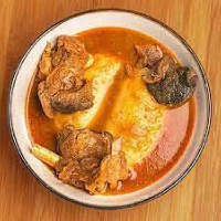 File Photo: A bowl of fufu and meat