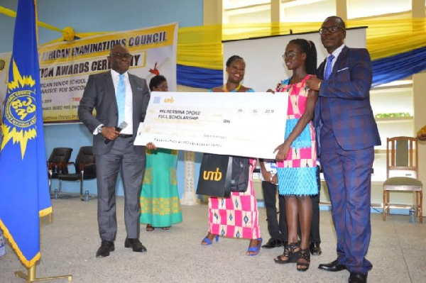 Wilhermina Opoku receiving the cheque