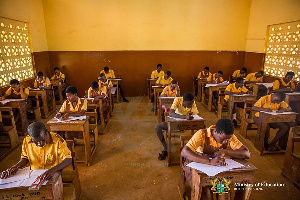 File Photo of pupils writing BECE