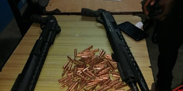 The pump-action shotguns and 100 rounds of AK-47 ammunition retrieved by the police