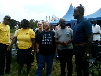 Rev. Lord Ashanti Boadi (extreme left) in a handshake with Nicolas Baako, MCE of Assin North