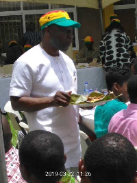 Ken Ofori-Atta, Finance Minister with a plate of Kenkey