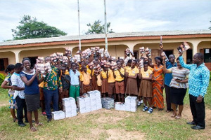 Students and officials take the group photograph after the presentation