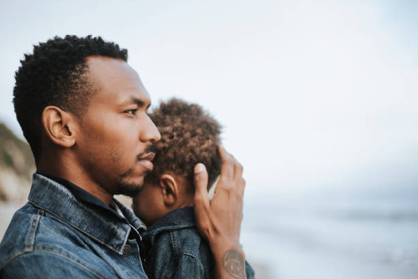 Fiel photo of man with baby