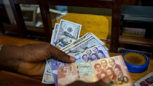 File photo of Ghana cedis and dollar notes