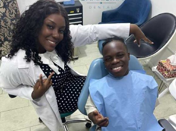 Shatta Bandle with his dentist, Dr. Louisa