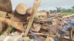 According to eyewitnesses, the timber logs fell from the moving truck and crushed the cargo car