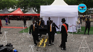 Ebony's remains being carried from the funeral grounds