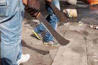 Men holding machetes