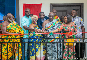 Osagyefo Amoati Ofori Panin II cutting the ribbon for the official opening