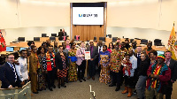 Mayor Brown presenting the framed proclamation to the Consul General Hon. Seshie