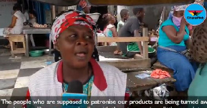 A Kasoa market trader counting her losses