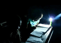 Students studing with candle light in Krobo