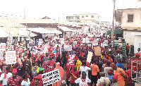 The demonstrators walked through the principal streets of Kumasi Tuesday to protest