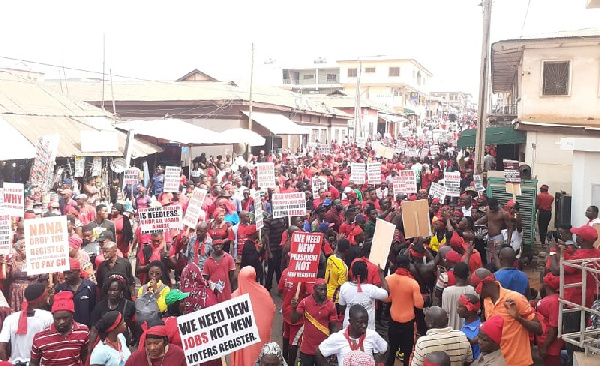 The demonstrators walked through the principal streets of Kumasi Tuesday to protest