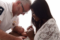 Yvonne Okyere-Whalley with her baby, husband