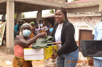 One of the beneficiaries receiving her item