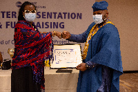 A Rotary club member receiving the Charter