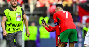 Five people made it on to the pitch to try and take pictures with Cristiano Ronaldo