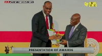 The award was presenter by President Nana Akufo-Addo [R]