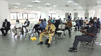 Members of the Parliamentary Select Committee in a meeting management