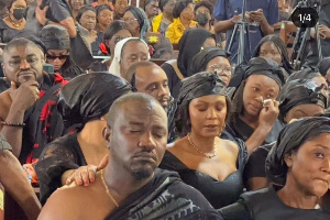 Dumelo with family, sympathisers during mother's burial service