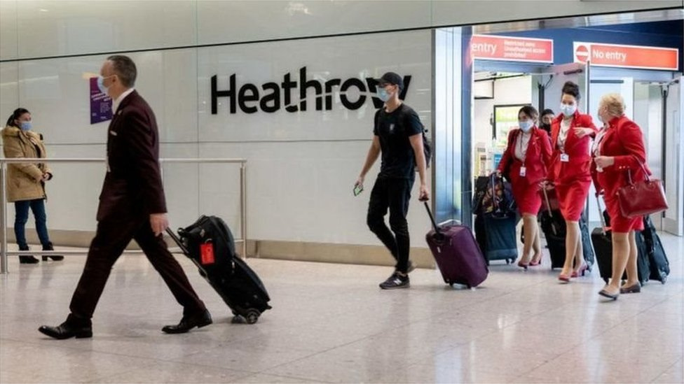 File photo of passengers olus airline staff for airport