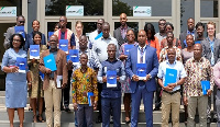 Mayor of Accra in a group picture with some members of International Organization for Migration