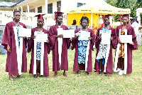 Some of the graduates displaying their certificates after the graduation ceremony