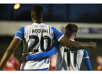 Emile Acquah celebrates with teammate after scoring a for Barrow