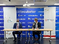 (Leff) Kwamina K. Asomaning and (Right) Gerald Guskowski during the signing