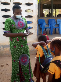 Tangoba Abayage interacting with school children