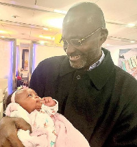 Hon Kennedy Agyapong cuddles baby Maxin