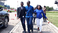 Ernesto Yeboah, being whisked away from Parliament