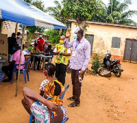 Minister of Chieftaincy and Religious Affairs, Mr. Kofi Dzamesi at a registration center