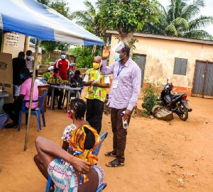 Minister of Chieftaincy and Religious Affairs, Mr. Kofi Dzamesi at a registration center