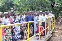 People of Brunso with the MP and DCE standing on the bridge