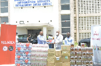 Deputy Information Minister Pius Hadzide [L] receiving the items