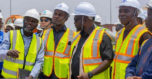 Francis Asenso-Boakye (middle) urges contractors to speed up project during inspection