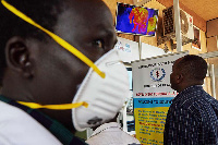 Passengers from an international flight are screened for their temperature, | ALEX MCBRIDE | AFP