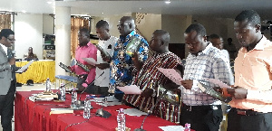 Officials of Sefwi Akontombra District Assembly take the oath of office at the PAC hearing