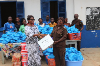 Mrs Rejoice Buafor, presenting the items to Senior Chief Officer Comfort Amponsah Bio.