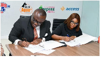 Matilda Asante-Asiedu and CEO of EIB Network, Nathan Anokye Adisi signing the partnership docume