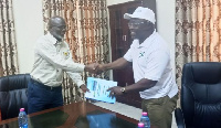 Technical Director of E&P, Mr. Abudu handing over documents of the equipment to Prof Amankwaa